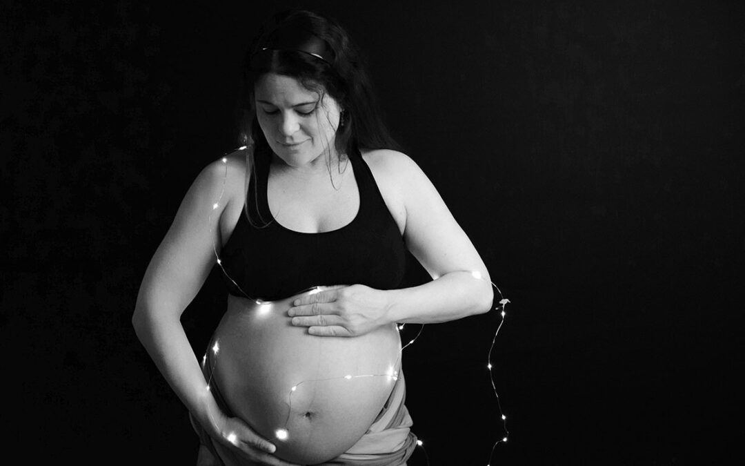 Pregnant Woman with Christmas lights